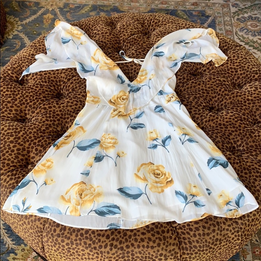 White dress with Blue and Yellow floral roses.